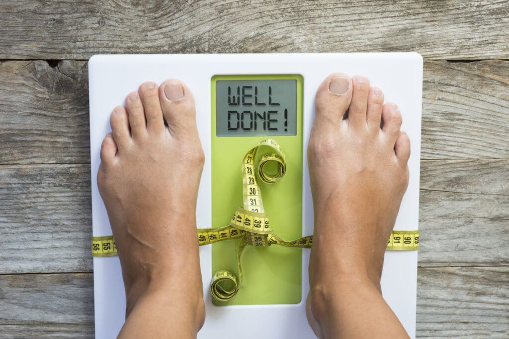 Diet motivation message on weight scale suggesting losing kilogram success